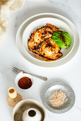 Fried Chili Spicy Egg Breakfast with Fresh Avocado on White Kitchen Background