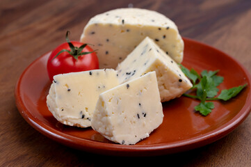Traditional polish white cheese with black chives seeds made in North Poland in Kaszebe area near Gdynia.