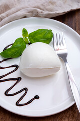 Tasing of fresh italian cheese mozzarella di buffalo with Balsamic vinegar from Modena
