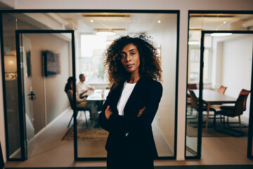 Fototapeta na wymiar Confident businesswoman standing in an office