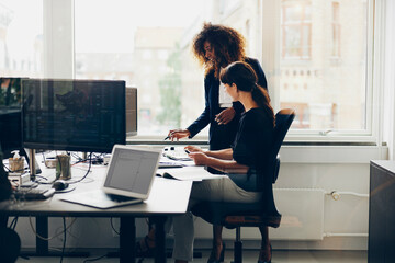 Smiling businesswomen working in an office