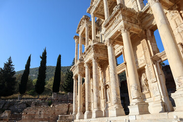 beautiful facade with columns of Library of Celsus in archaeological site Ephesus in Turkey under clear blue sky