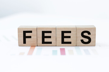 FEES on wooden blocks. Fixed price for a specific service. Business concept.