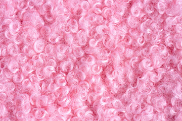 Elegant curly pink wool background.