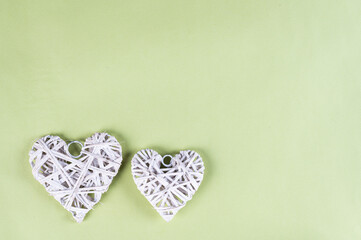 White Day background. White and grey hearts on green background. Valentines day concept. Flat lay, top view, copy space. Mothers day flatlay. Heart flatly. Love