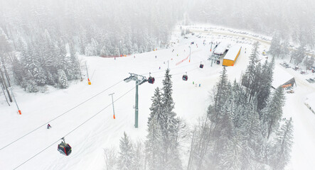 The gondola transports skiers to the top of the ski resort.Aerial view