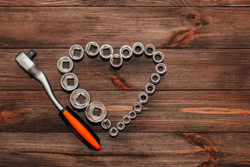Nuts to a wrench, a set of tools in the shape of a heart. Valentine's Day gift for a man.
