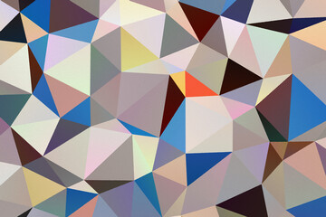 Fototapeta premium Graphic, abstract and geometric pattern of colorful triangles on textured paper background. Colourful abstract composition. High resolution full frame triangular shape geometric background.