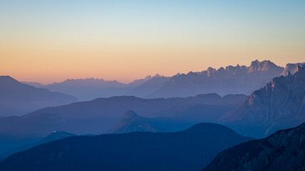 Fototapeta na wymiar Sunrise over a mountain valley in the Dolomites, Italy