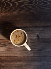 Coffee cup on dark wood background