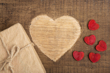 Valentine's Day greetings concept. Gift boxes and Heart shape carved on the wood. Valentines...