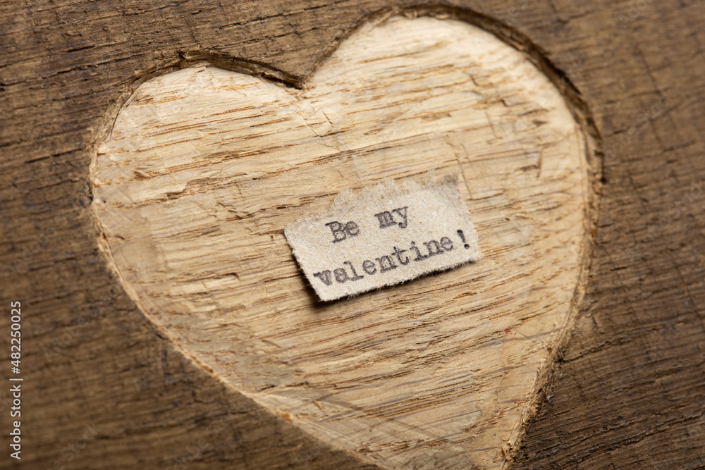 Fototapete be my valentine - tiny typed text note close up. valentines day greetings concept. carved heart shap