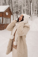 Young Asian woman in winter location with snow