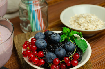 Fresh and healthy berry fruits with muesli flakes and yogurt 