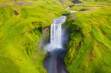 Iceland. Aerial view on the Skogafoss waterfall. Landscape in the Iceland from air. Famous place in Iceland. Landscape from drone.