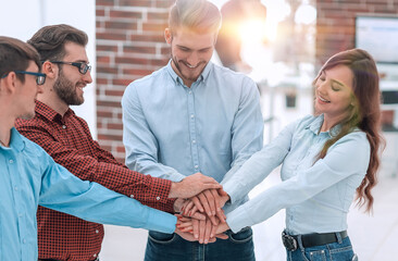 Group of people hands together partnership teamwork.