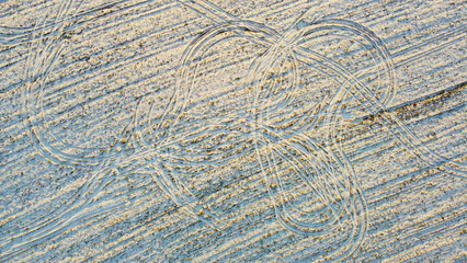 Texture of a snowy winter field. Photo from above