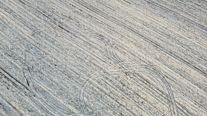 Texture of a snowy winter field. Photo from above