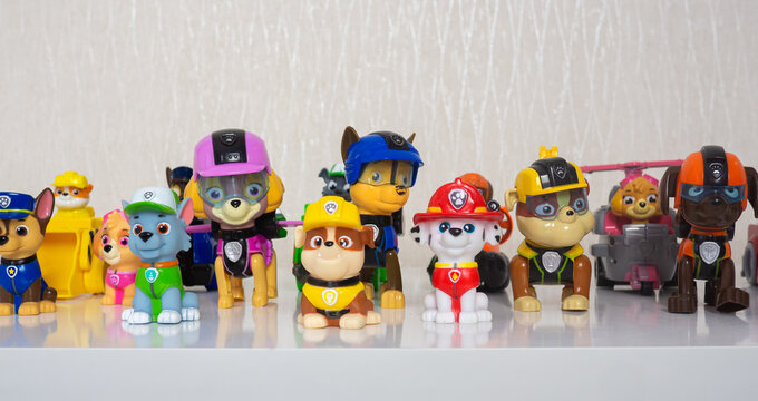 Minsk, Belarus - January 9, 2022: Paw patrol team. Many different miniatures of heroes of the animated series. special equipment and cars. selective focus