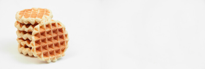 Belgian waffles on a table. holiday cookies on a white background. fresh baking concept. sweet desserts on a light texture