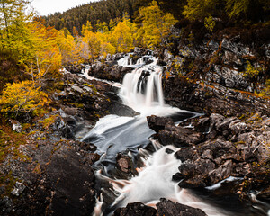 Scenic Waterfall in an Scotland Autumn Forest