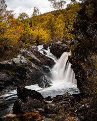 Scenic Waterfall in an Scotland Autumn Forest