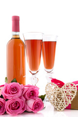A glasses of wine, roses and gift