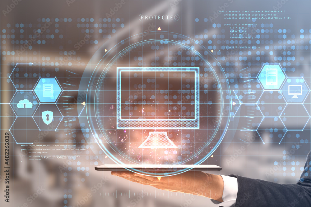 Poster close up of businessman hand holding tablet with creative glowing computer hologram interface on blu