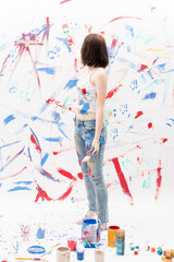 child painting with paint