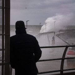 Man watching waves crash