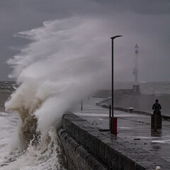 Fototapeta na wymiar Crashing waves onto Bridlington Harbour
