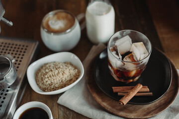 Iced Brown Sugar Oat Milk Latte Ingredients. Process of Making Iced Coffee. Moody Coffee Shop Lifestyle. Iced Coffee Flat Lay with Copy Space. Stir and Pour.
