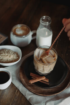 Iced Brown Sugar Oat Milk Latte Ingredients. Process Of Making Iced Coffee. Moody Coffee Shop Lifestyle. Iced Coffee Flat Lay With Copy Space. Stir And Pour.
