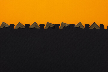orange and black paper with photo corners