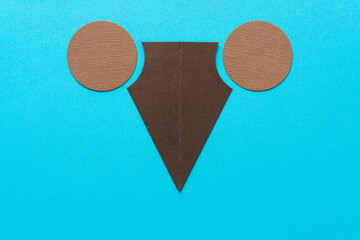 abstract paper shapes (circles and arrow) on blue paper background