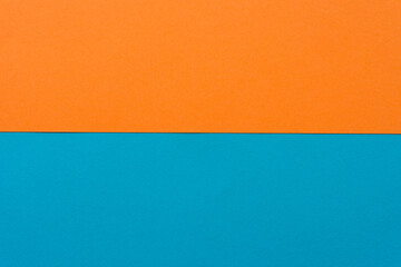 paper background in orange an blue