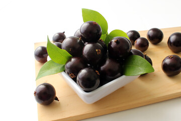 Exotic Jabuticaba fruit on wooden table