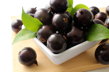 Exotic Jabuticaba fruit on wooden table