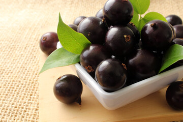 Exotic Jabuticaba fruit on wooden table