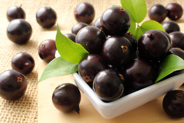 Exotic Jabuticaba fruit on wooden table