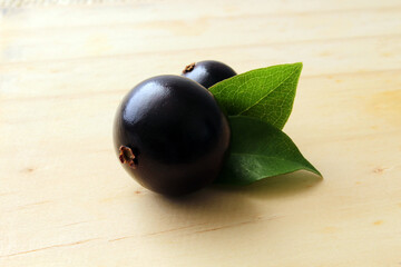 Exotic Jabuticaba fruit on wooden table