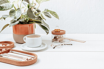 Modern eco friendly desktop with zero waste stationary and white coffee cup mockup. Comfortable working space, sustainable life style concept