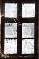 Old window in abandoned house.