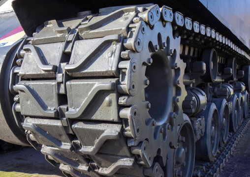 Side view of tracks on  WWII M4A2E8 Sherman tank, outdoors, daytime, nobody