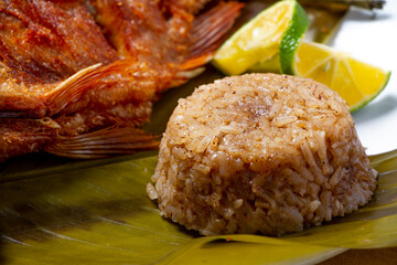 Portion of coconut rice in a traditional Colombian fish dish