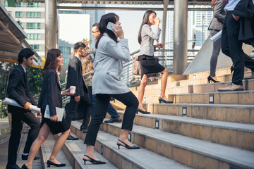 Crowd business people walking step in modern city office life. Group of businesspeople busy life...