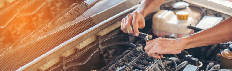 Banner Man hands fixing Car machinery vehicle mechanical service. Mechanic man hands repairing car...
