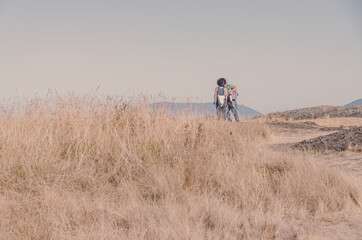 Couple kissing on the hill