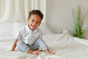 Little smiling boy. playing afro american toddler. Positive kid. Cute baby. The concept of a happy childhood and child care.