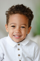 Little smiling boy. playing afro american toddler. Positive kid. Cute baby. The concept of a happy childhood and child care.